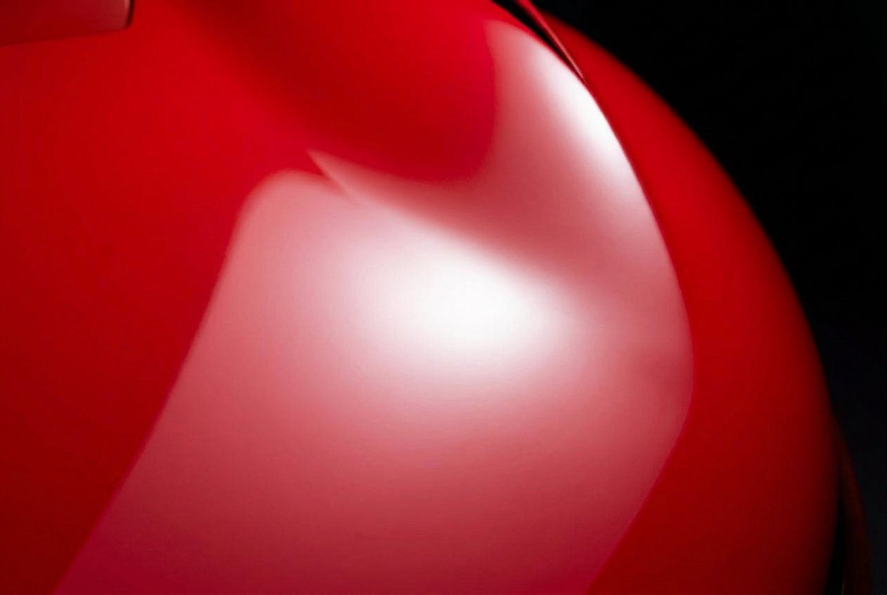 Red Ferrari paint with clear reflections after paint correction